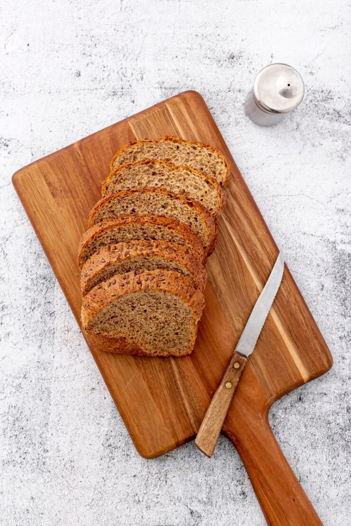 cut-slices-of-wholemeal-bread-on-wooden-board_23-2148361622.jpg